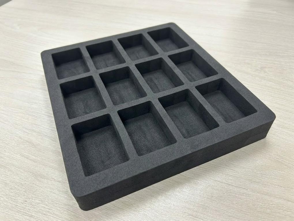 Black ESD Foam Tray with Compartmentalized Storage Grid Black anti-static ESD foam tray with a grid of rectangular compartments for component storage